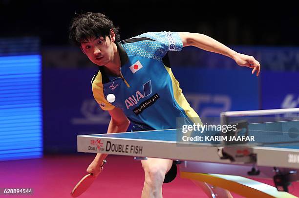 Yuto Muramatsu of Japan plays a shot during his men's single quarter-final table tennis match against Xu Xin of China at the Qatar 2016 ITTF World...