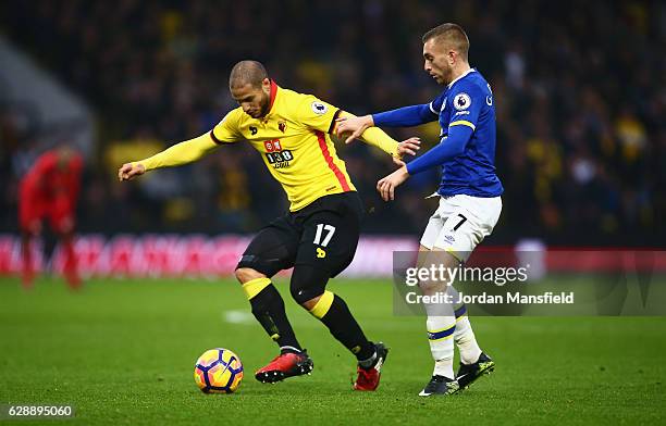 Adlene Guedioura of Watford holds off Gerard Deulofeu of Everton during the Premier League match between Watford and Everton at Vicarage Road on...