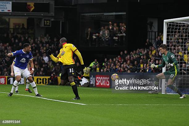 Watford's Italian striker Stefano Okaka shoots and scores past Everton's Dutch goalkeeper Maarten Stekelenburg during the English Premier League...