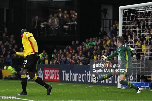 Watford's Italian striker Stefano Okaka shoots and scores past Everton's Dutch goalkeeper Maarten Stekelenburg during the English Premier League...