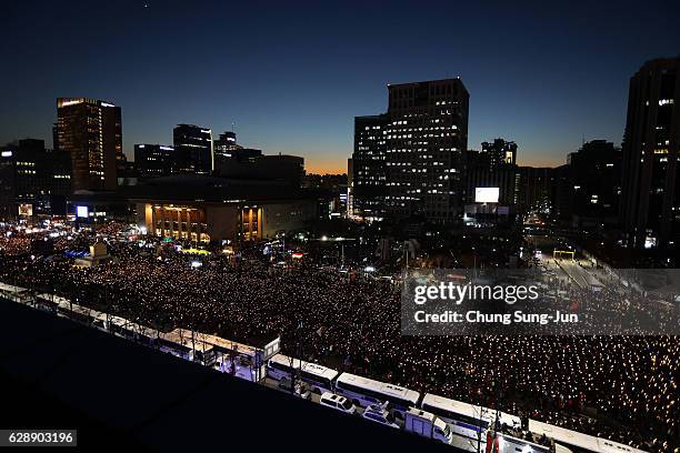 Masses of protesters gathered and occupy major streets in the city center for a rally against South Korean President Park Geun-Hye on December 10,...