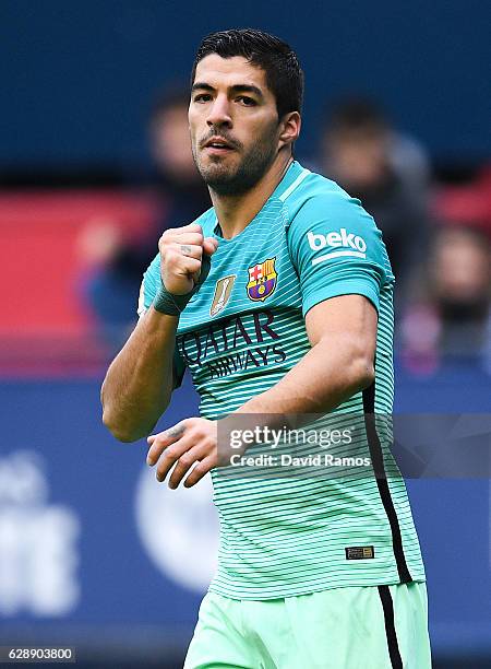 Luis Suarez of FC Barcelona celebrates after scoring the opening goal during the La Liga match between CA Osasuna and FC Barcelona at Sadar stadium...