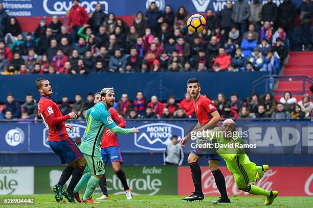 Lionel Messi of FC Barcelona scores his team's second goal during the La Liga match between CA Osasuna and FC Barcelona at Sadar stadium on December...