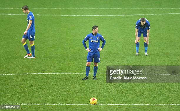 Dannie Bulman of AFC Wimbledon is dejected after his side go 1-0 down during the Sky Bet League One match between Milton Keynes Dons and AFC...