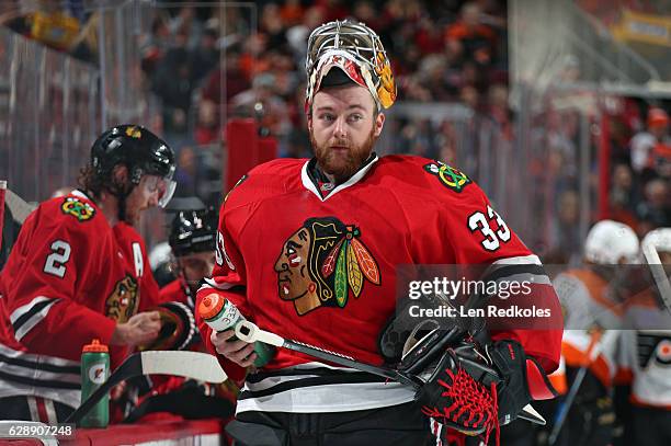 Scott Darling of the Chicago Blackhawks looks on during a timeout against the Philadelphia Flyers on December 3, 2016 at the Wells Fargo Center in...