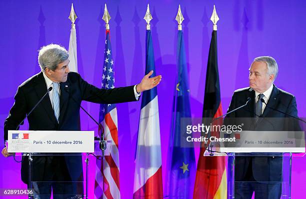 Secretary of State John Kerry delivers a speech next to French Foreign Affairs Minister Jean-Marc Ayrault during a joint news conference after...