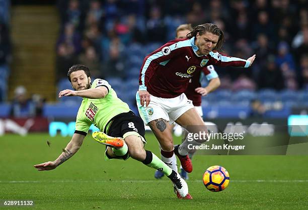 Harry Arter of AFC Bournemouth tackles Jeff Hendrick of Burnley during the Premier League match between Burnley and AFC Bournemouth at Turf Moor on...