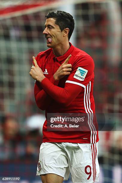 Robert Lewandowski of Muenchen celebrates scoring the second goal during the Bundesliga match between Bayern Muenchen and VfL Wolfsburg at Allianz...