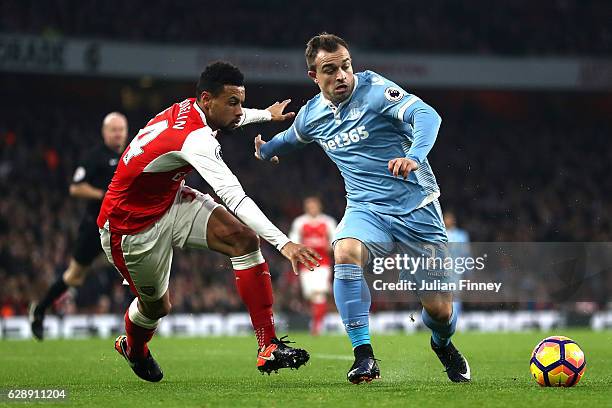 Francis Coquelin of Arsenal and Xherdan Shaqiri of Stoke City battle for possession during the Premier League match between Arsenal and Stoke City at...