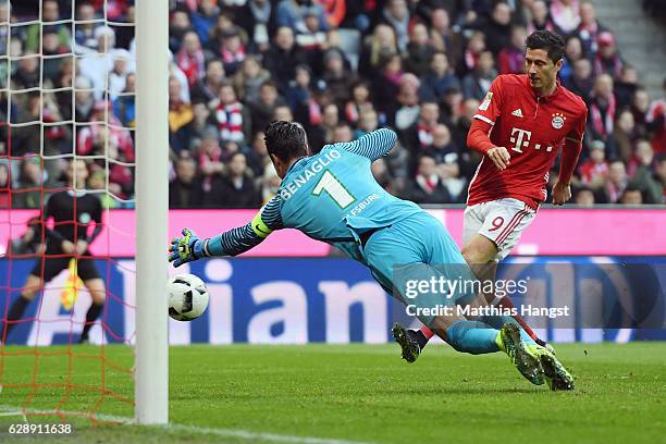 Robert Lewandowski of Muenchen scores his team's second goal past goalkeeper Diego Benaglio of Wolfsburg during the Bundesliga match between Bayern...