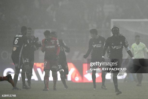 Olympique de Marseille's French forward Bafetimbi Gomis celebrates after scoring a goal during the French L1 football match Dijon vs Marseille on...