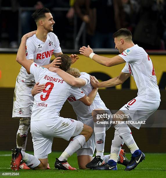 Cologne's Latvian striker Artjoms Rudnevs celebrates scoring during the German first division Bundesliga football match between 1 FC Cologne and...