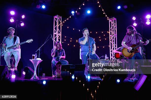 Recording artists Jon Jones, Chris Thompson, Mike Eli, and James Young of Eli Young Band perform onstage during CMT Story Behind The Songs LIV +...