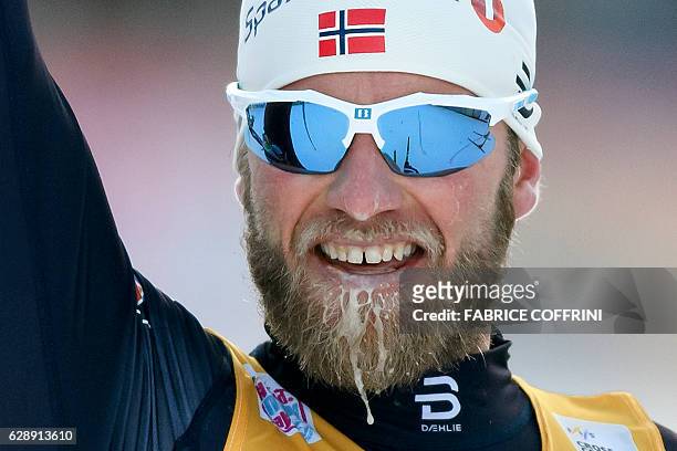 Norway's Martin Johnsrud Sundby celebrates his victory in the Men's 30km individual free race at the FIS Cross Country World Cup Nordic skiing event...