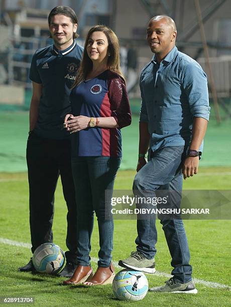 Nita Ambani, director of the Indian Super League , poses for photographs with former Manchester United players Quinton Fortune and Bojan Djordjic...