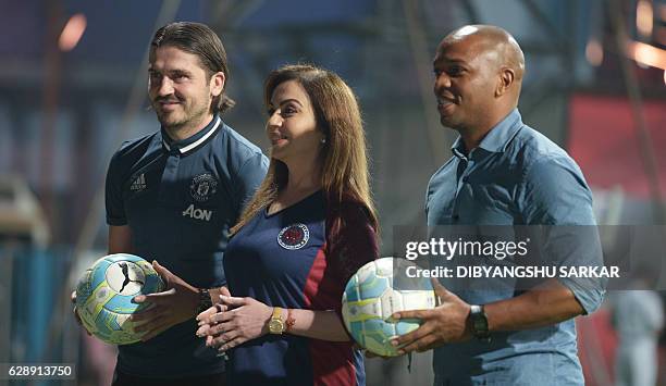 Nita Ambani, director of the Indian Super League , poses for photographs with former Manchester United players Quinton Fortune and Bojan Djordjic...