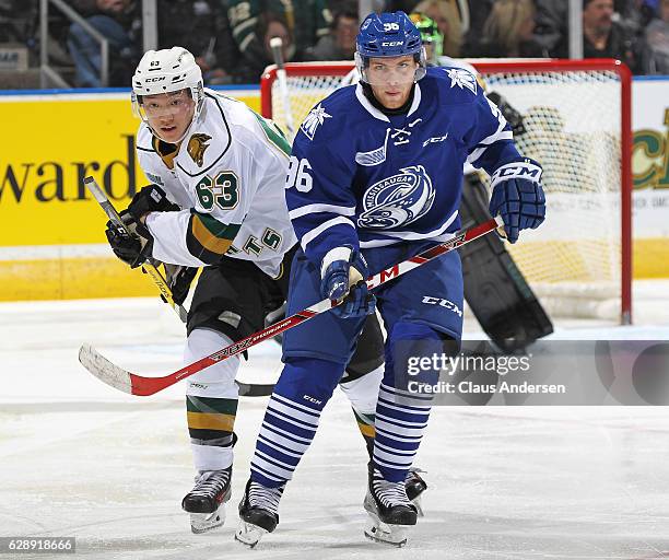 Spencer Watson of the Mississauga Steelheads skates against Cliff Pu of the London Knights during an OHL game at Budweiser Gardens on December 9,...