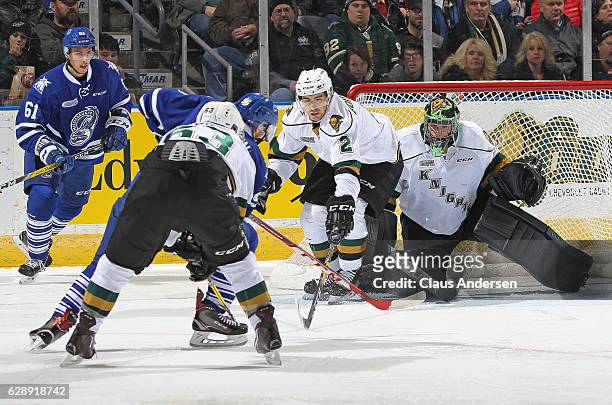 Tyler Parsons of the London Knights looks for a shot from Spencer Watson of the Mississauga Steelheads during an OHL game at Budweiser Gardens on...