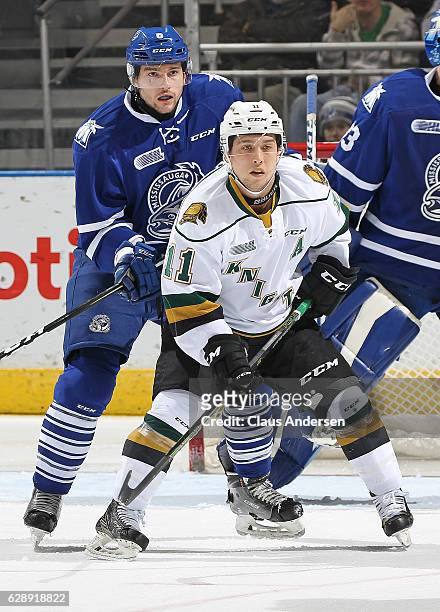 Stephen Gibson of the Mississauga Steelheads battles against Owen MacDonald of the London Knights during an OHL game at Budweiser Gardens on December...