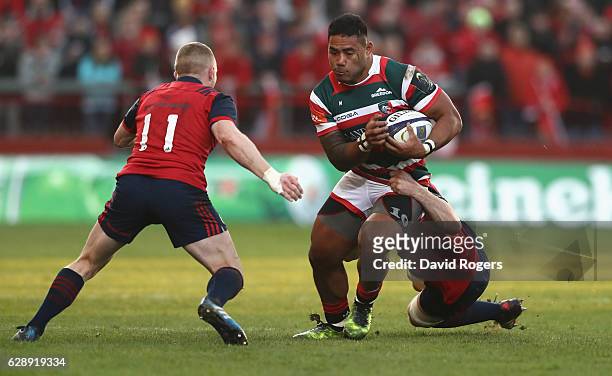 Manu Tuilagi of Leicester is tackled by Peter O'Mahony and Keith Earls during the European Champions Cup match between Munster and Leicester Tigers...