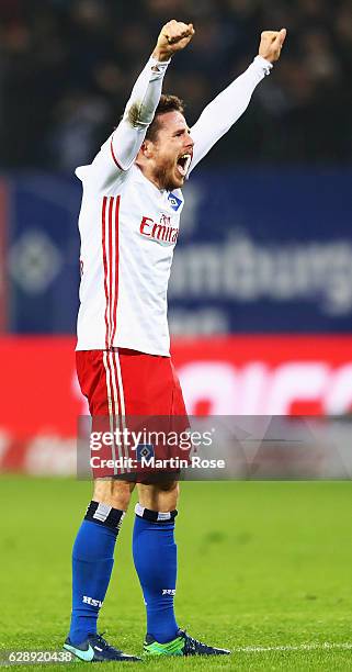 Nicolai Müller of Hamburg celebrates the first goal scored by Filip Kostic during the Bundesliga match between Hamburger SV and FC Augsburg at...