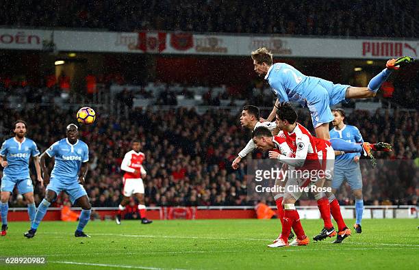 Peter Crouch of Stoke City heads towards goal during the Premier League match between Arsenal and Stoke City at the Emirates Stadium on December 10,...