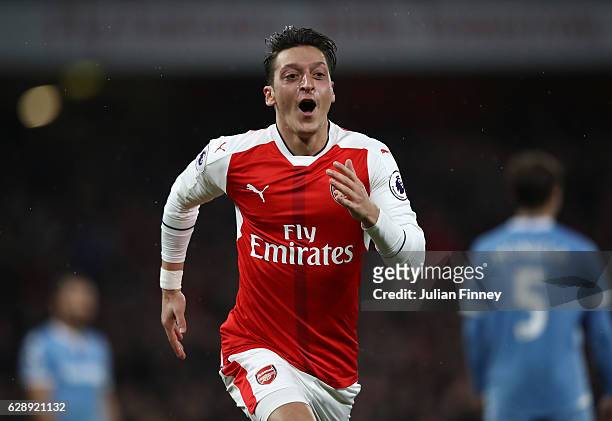 Mesut Ozil of Arsenal celebrates scoring his sides second goal during the Premier League match between Arsenal and Stoke City at the Emirates Stadium...