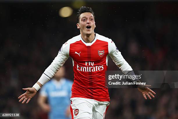 Mesut Ozil of Arsenal celebrates scoring his sides second goal during the Premier League match between Arsenal and Stoke City at the Emirates Stadium...