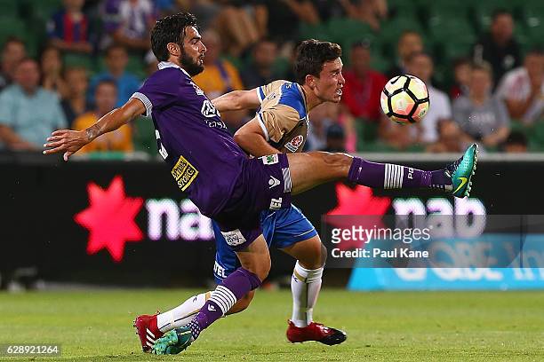 Rhys Williams of the Glory and Devante Clut of the Jets contest for the ball during the round 10 A-League match between the Perth Glory and the...