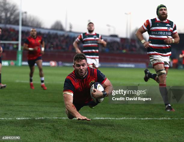 Jaco Taute of Munster dives in for a try during the European Champions Cup match between Munster and Leicester Tigers at Thomond Park on December 10,...