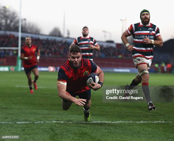 Jaco Taute of Munster dives in for a try during the European Champions Cup match between Munster and Leicester Tigers at Thomond Park on December 10,...