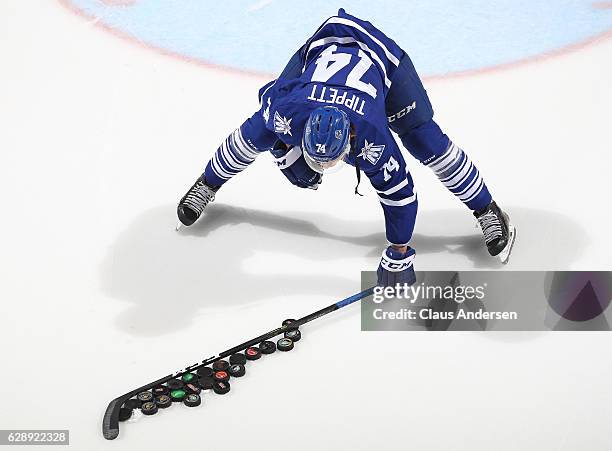 Owen Tippett of the Mississauga Steelheads gets the warm-up pucks ready prior to play against the London Knights in an OHL game at Budweiser Gardens...