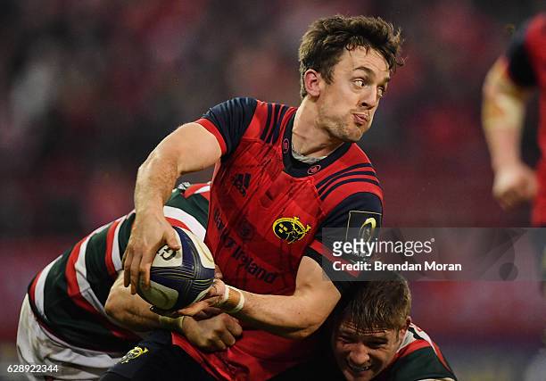 Limerick , Ireland - 10 December 2016; Darren Sweetnam of Munster is tackled by Adam Thompstone, left, and Tom Youngs of Leicester Tigers during the...
