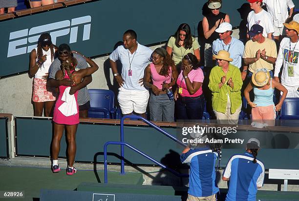 Serena Williams hugs her father after a match against Kim Clijsters during the Tennis Masters Series at the Indian Wells Garden in Indian Wells,...