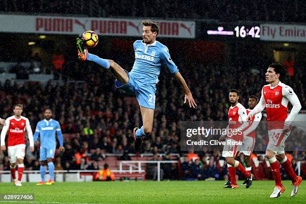 Peter Crouch of Stoke City controls the ball in mid air during the Premier League match between Arsenal and Stoke City at the Emirates Stadium on...