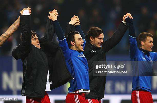 Gotoku Sakai of Hamburg celebrates with teamates their win at the end of the Bundesliga match between Hamburger SV and FC Augsburg at...