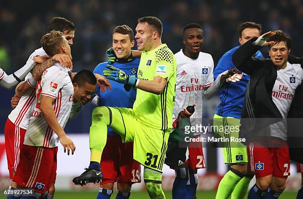Luca Waldschmidt and Christian Mathenia of Hamburg celebrate their win at the end of the Bundesliga match between Hamburger SV and FC Augsburg at...