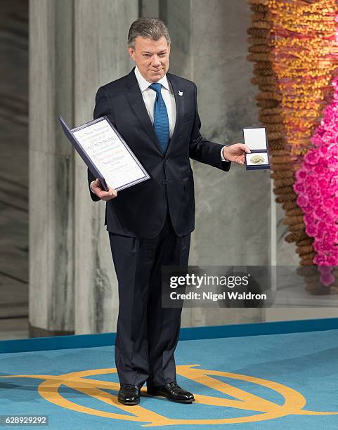 President Juan Manuel Santos of Colombia receives his Nobel Peace Prize Award during the Nobel Peace Prize ceremony at Oslo Town Hall on December 10,...
