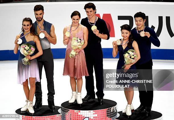 First placed Canadian Tessa Virtue and Scott Moir , second placed French Gabriella Papadakis and Guillaume Cizeron and third placed US Maia Shibutani...