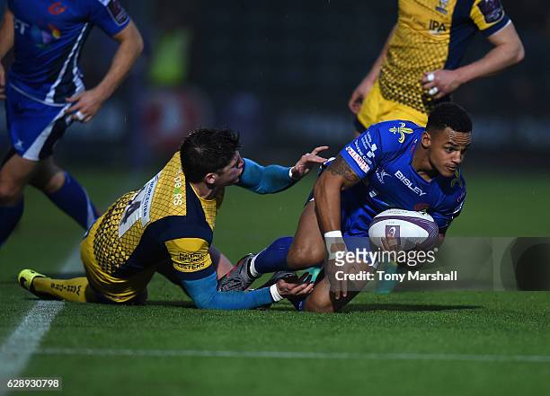 Ben Howard of Worcester Warriors tackles Ashton Hewitt of Newport Gwent Dragons during the European Rugby Challenge Cup match between Worcester...