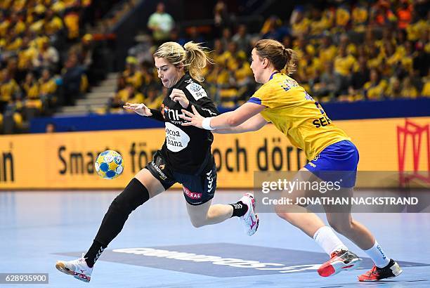 Netherlands' Estavana Polman and Sweden's Anna Lagerquist vie for the ball during the Women's European Handball Championship Group I match between...