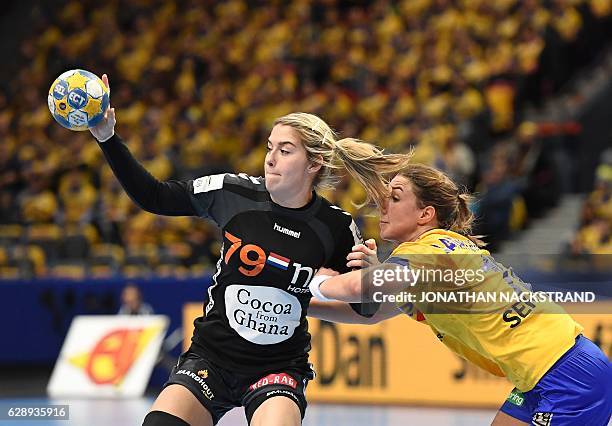 Netherlands' Estavana Polman and Sweden's Anna Lagerquist vie for the ball during the Women's European Handball Championship Group I match between...