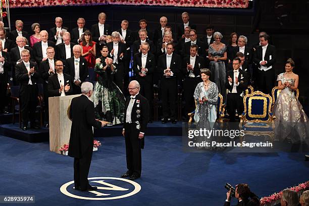 Professor Bengt Holmstrom, laureate of The Sveriges Riksbank Prize in Economic Sciences in Memory of Alfred Nobel receives his Nobel Prize from King...