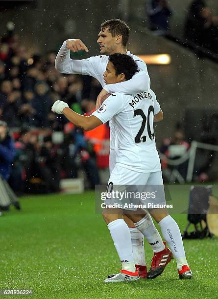 Fernando Llorente of Swansea City celebrates his second goal with team mate Jefferson Montero during the Premier League match between Swansea City...