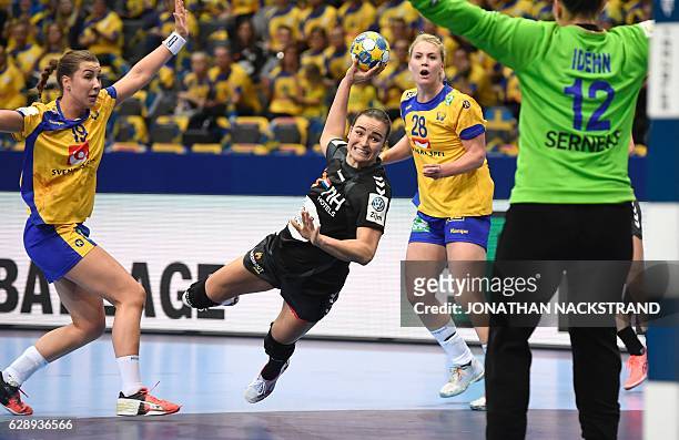 Netherlands' Yvette Broch prepares to throw the ball towards Sweden's goalkeeper Filippa Idehn during the Women's European Handball Championship...