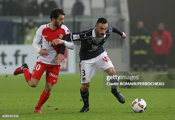 Bordeaux' German defender Diego Contento and Monaco's Portuguese midfielder Bernardo Silva vie for the ball during the French L1 football match...