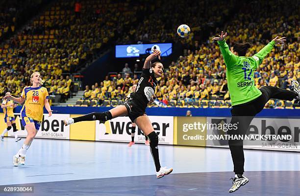 Sweden's goalkeeper Filippa Idehn jumps to stop a throw by Netherlands' Yvette Broch during the Women's European Handball Championship Group I match...