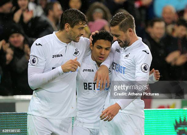 Fernando Llorente of Swansea City celebrates his second goal with Jefferson Montero and co-scorer Gylfi Sigurdsson during the Premier League match...