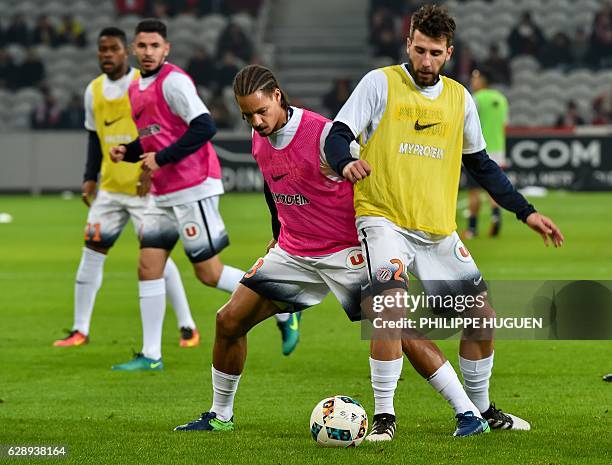 Montpellier's French defender Daniel Congre and Montpellier's French defender Mathieu Deplagne warm up ahead of the French L1 football match Lille vs...