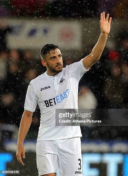 Neil Taylor of Swansea City thanks home supporters at the end of the game during the Premier League match between Swansea City and Sunderland at The...